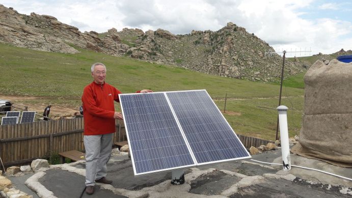 Prof Enebish Namjil, project partner in the BMBF-funded PV-2-Heat project, setting up a new PV system.